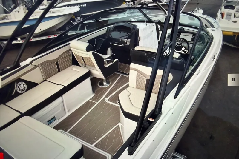 Slide: The Image of 2024 Monterey 255SS Super Sport boat interior with luxurious seating and modern dashboard. - 7