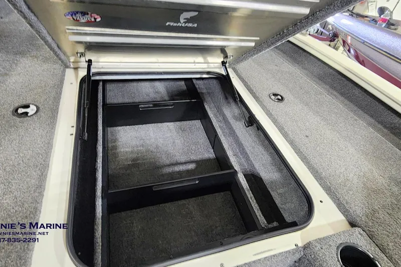 Slide: The Image of Open storage compartment in 2021 Tracker Pro Team 190 TX Tournament Edition boat. - 12