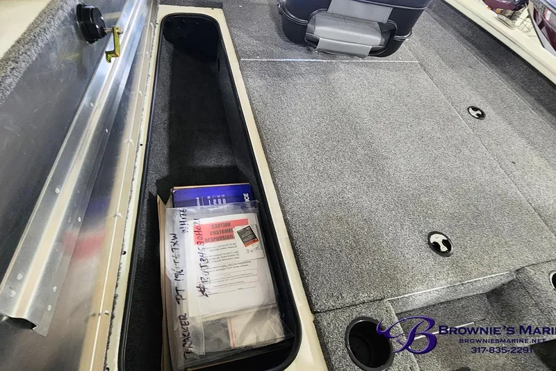 Slide: The Image of 2021 Tracker Pro Team 190 TX Tournament Edition boat interior storage compartment. - 13