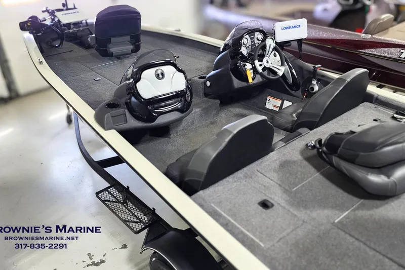 Slide: The Image of 2021 Tracker Pro Team 190 TX Tournament Edition boat interior with steering console and seating. - 5