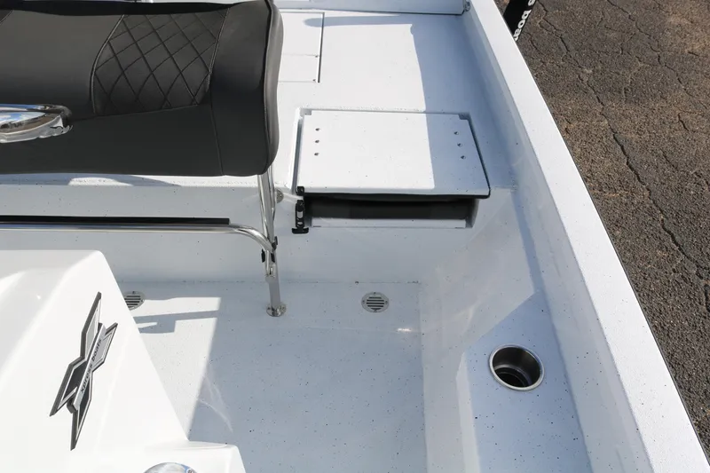 Slide: The Image of 2026 Xpress H20B Bay boat interior with seating and storage compartment. - 17