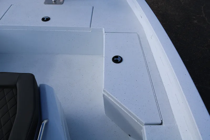 Slide: The Image of 2026 Xpress H20B Bay boat interior with storage compartments and seating. - 28