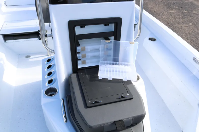 Slide: The Image of 2026 Xpress H20B Bay boat interior with tackle storage and rod holders. - 32