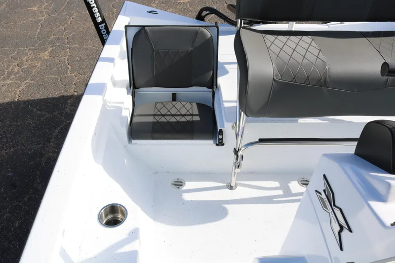Slide: The Image of 2026 Xpress H20B Bay boat interior with gray seating and stainless steel accents. - 36