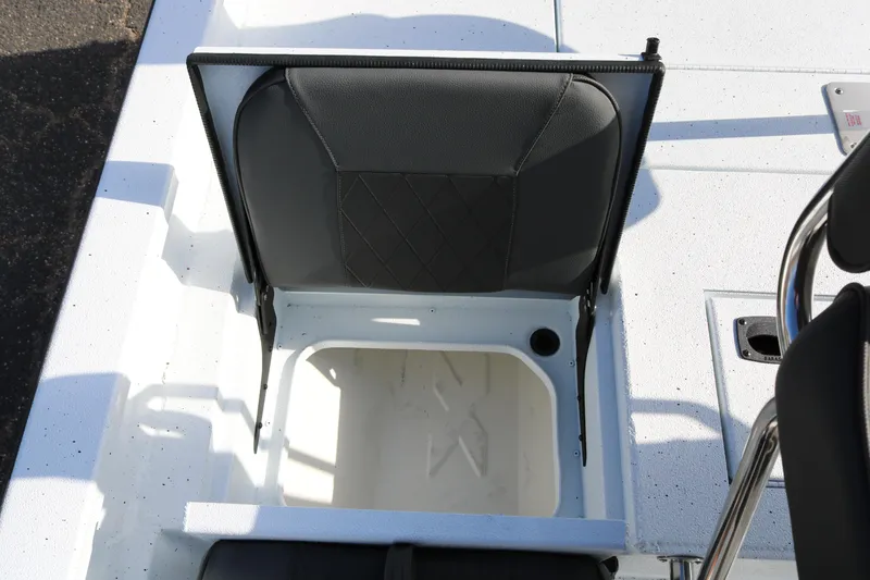 Slide: The Image of 2026 Xpress H20B Bay boat seat with storage compartment open. - 37