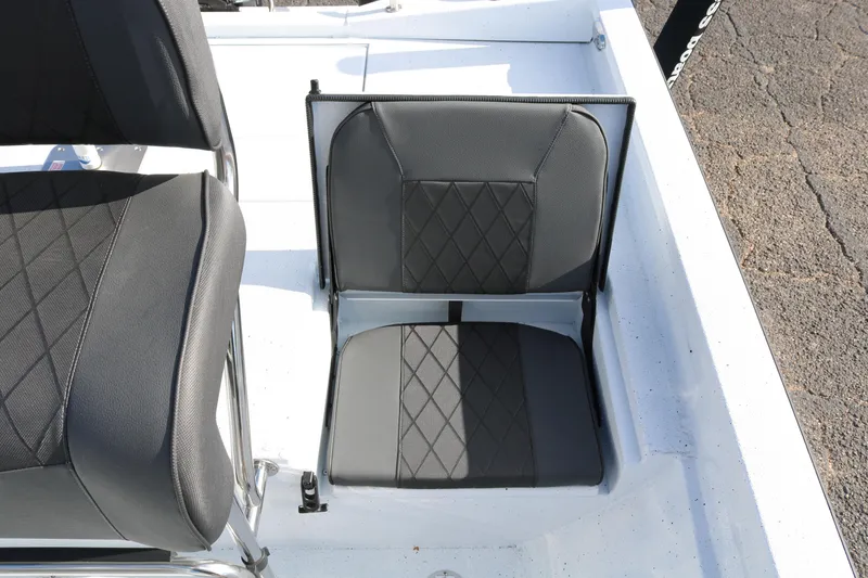 Slide: The Image of 2026 Xpress H20B Bay boat with black diamond-stitched seating detail. - 41