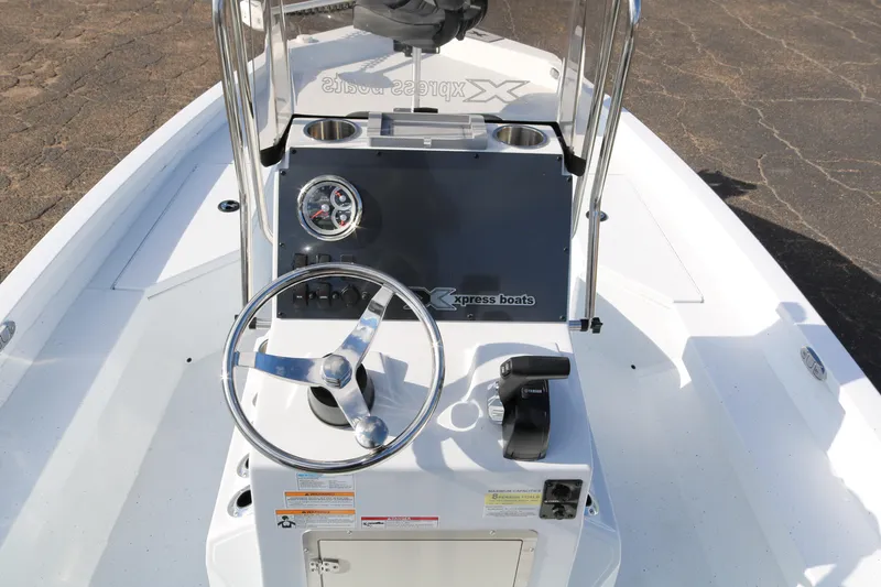 Slide: The Image of 2026 Xpress H20B Bay boat console with steering wheel and controls. - 45