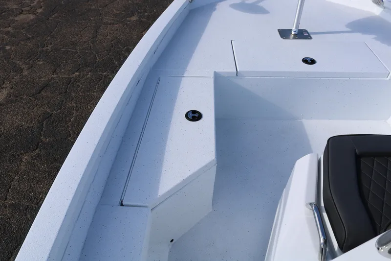 Slide: The Image of 2026 Xpress H20B Bay boat interior with white deck and black seating. - 5