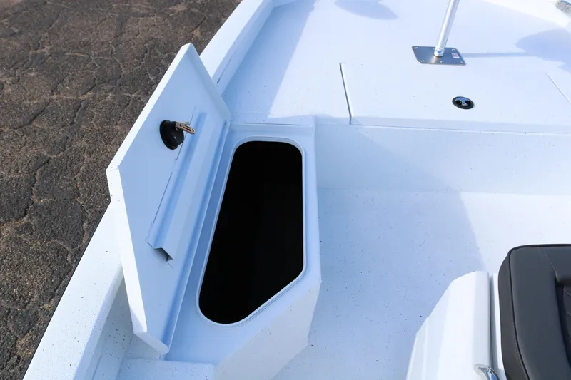 Slide: The Image of 2026 Xpress H20B Bay boat storage compartment open on deck. - 6