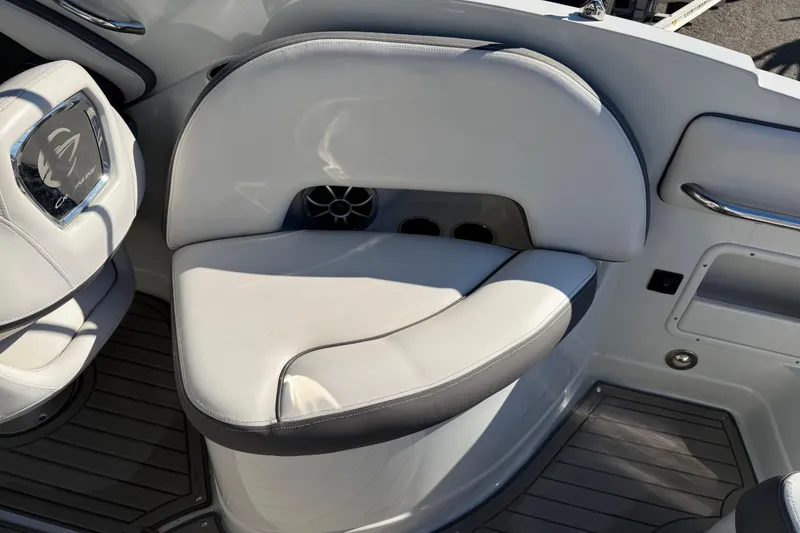 Slide: The Image of 2019 Crownline Eclipse E255 XS boat interior with white cushioned seating. - 13