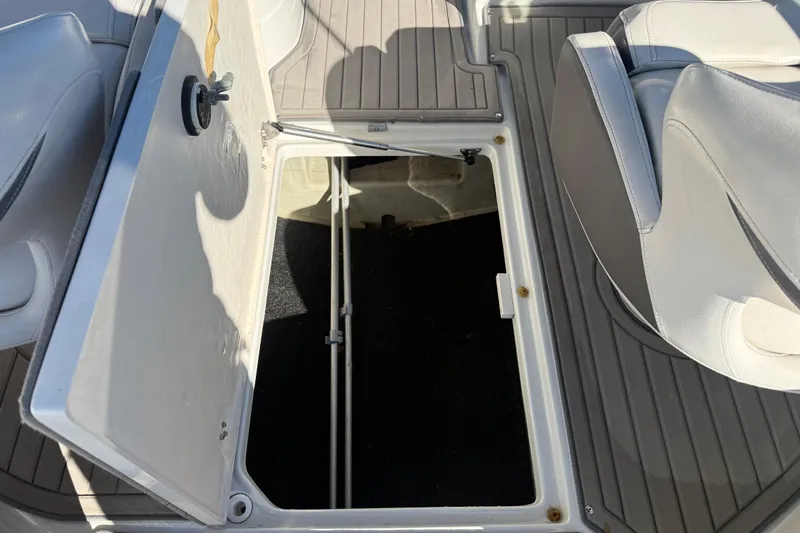 Slide: The Image of Open storage compartment in 2019 Crownline Eclipse E255 XS boat. - 14