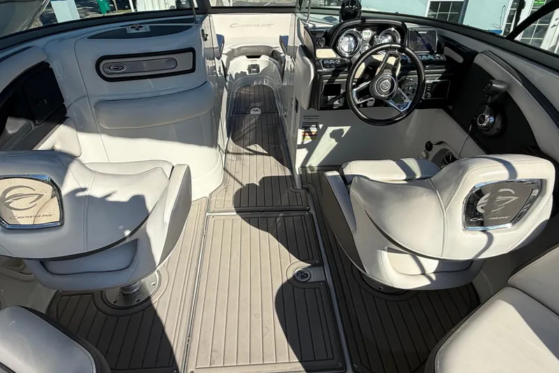 Slide: The Image of 2019 Crownline Eclipse E255 XS boat interior with steering wheel and seating. - 17