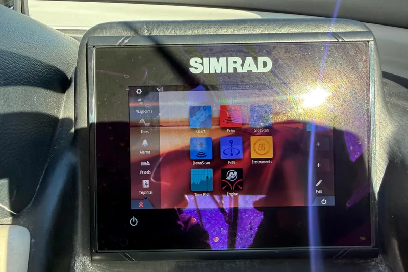 Slide: The Image of Simrad navigation display on 2019 Crownline Eclipse E255 XS boat dashboard. - 22