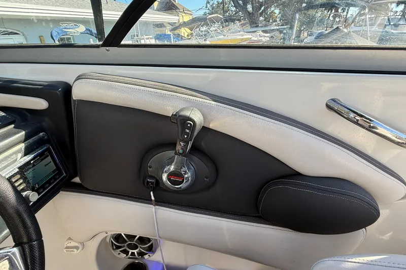 Slide: The Image of 2019 Crownline Eclipse E255 XS boat interior with control panel and audio system. - 27