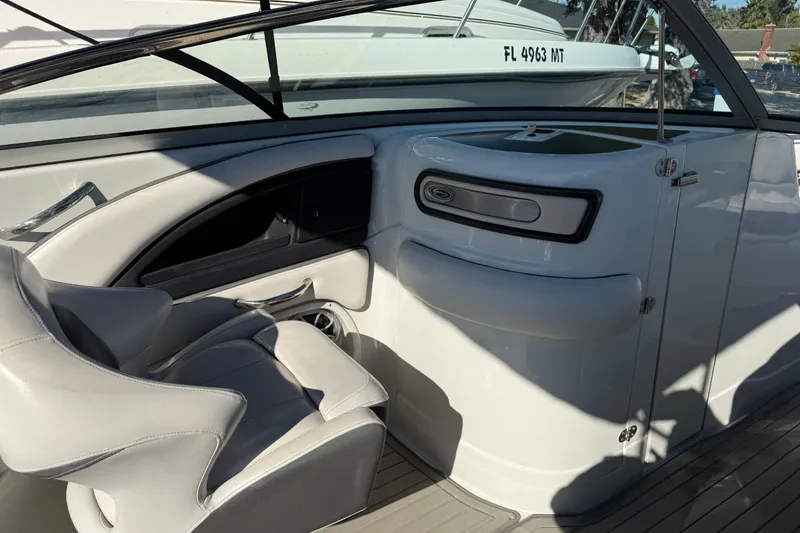 Slide: The Image of 2019 Crownline Eclipse E255 XS boat interior with seating and storage compartment. - 28