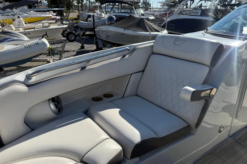 Slide: The Image of 2019 Crownline Eclipse E255 XS boat interior with luxurious seating and cup holders. - 36