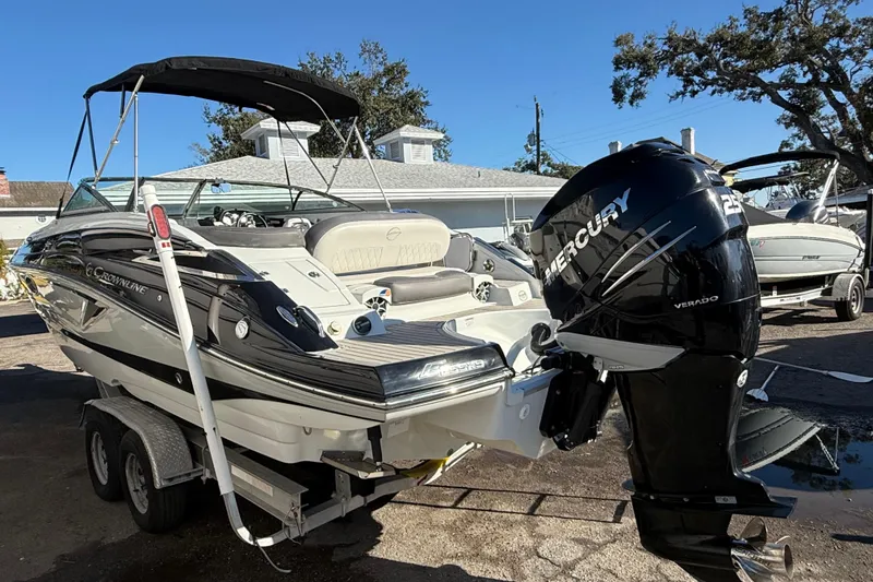 Slide: The Image of 2019 Crownline Eclipse E255 XS boat with Mercury engine on trailer. - 4