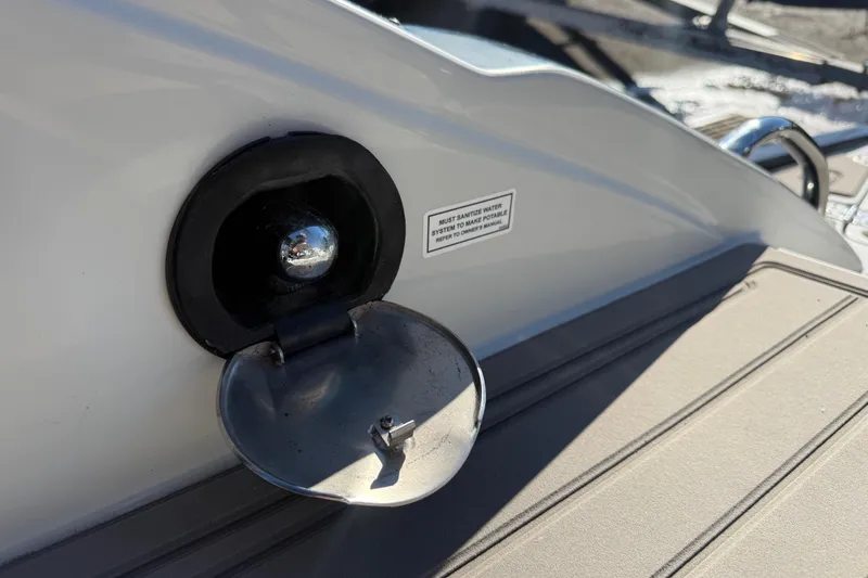 Slide: The Image of 2019 Crownline Eclipse E255 XS boat water inlet with open cap. - 9