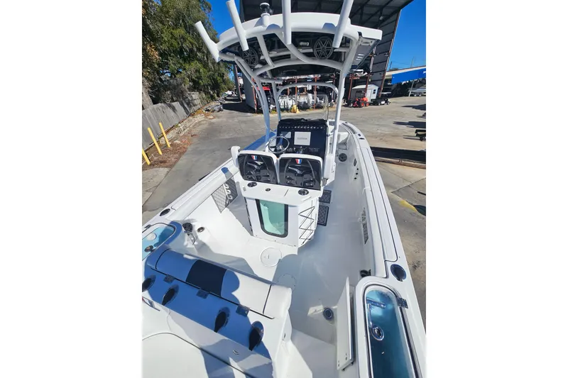 Slide: The Image of 2021 Wellcraft 242 Fisherman boat interior with modern console and seating. - 10