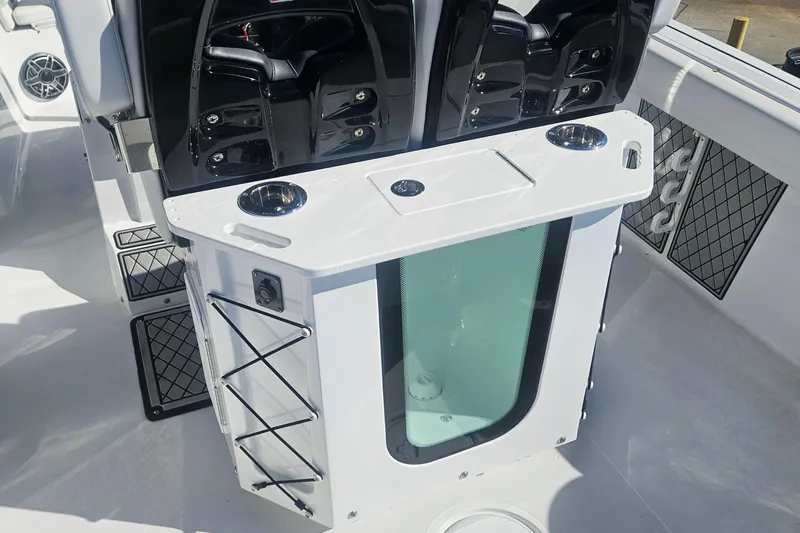 Slide: The Image of 2021 Wellcraft 242 Fisherman boat interior with dual engines and storage compartments. - 11