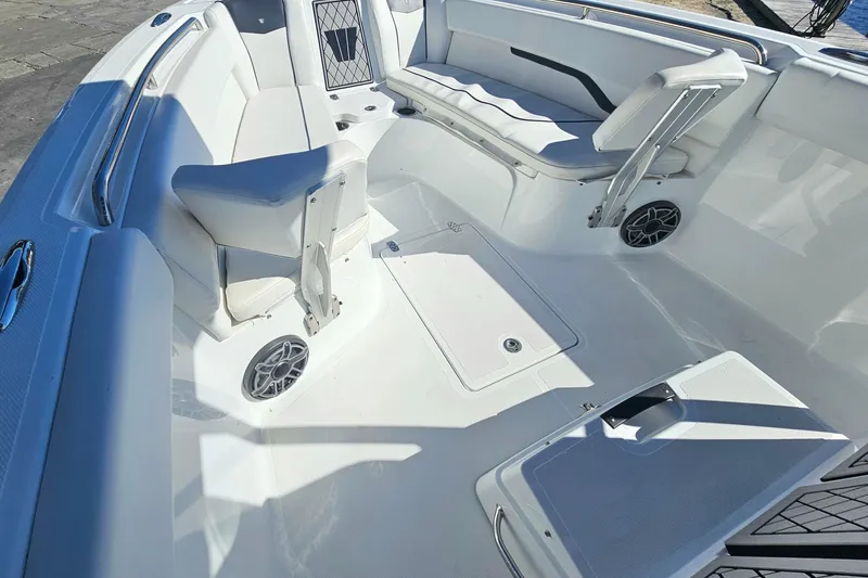 Slide: The Image of 2021 Wellcraft 242 Fisherman boat interior with white seating and modern design. - 23