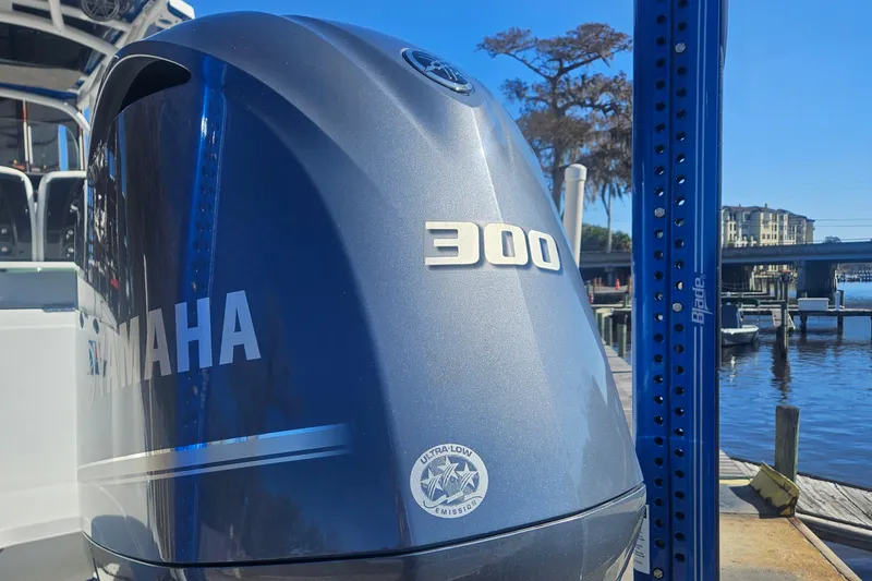 Slide: The Image of Yamaha 300 outboard engine on 2021 Wellcraft 242 Fisherman boat at marina. - 3