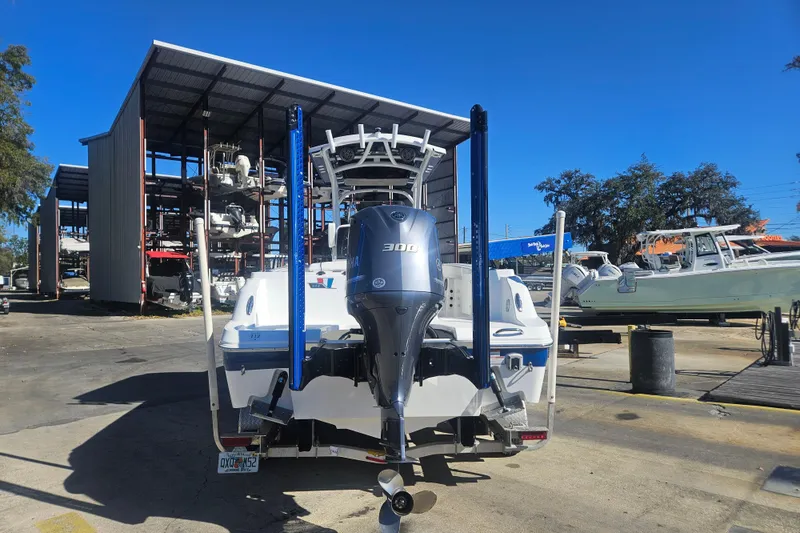 Slide: The Image of 2021 Wellcraft 242 Fisherman boat with Yamaha 300 engine at a marina storage facility. - 5