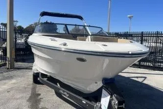 Slide: The Image of 2024 Sea Ray SPX 210 Outboard boat on trailer, parked outdoors. - 3