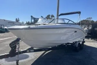 Slide: The Image of 2024 Sea Ray SPX 210 Outboard boat on trailer, parked outdoors. - 4