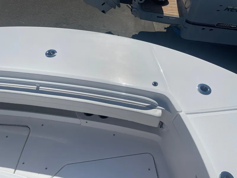 Slide: The Image of Regulator 31 boat 2025, front deck view, white design. - 14