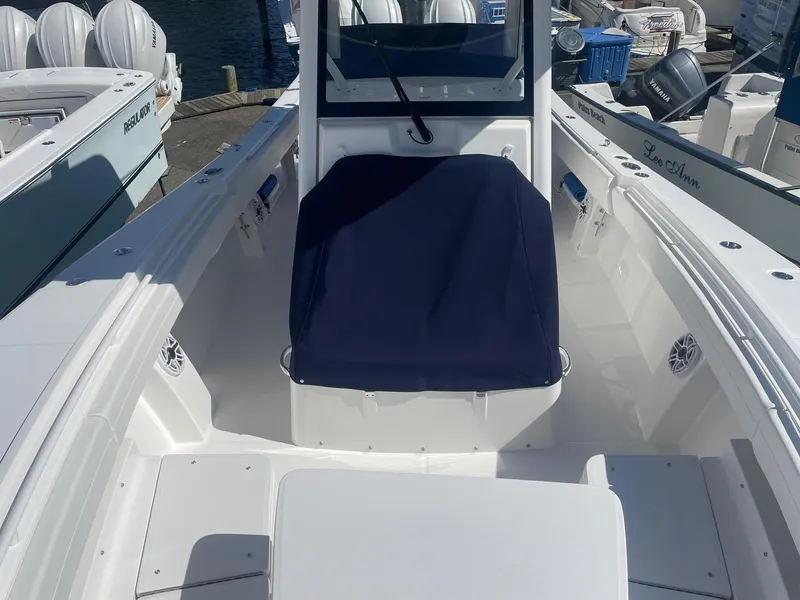 Slide: The Image of Regulator 31 boat 2025, front deck view at the marina. - 15