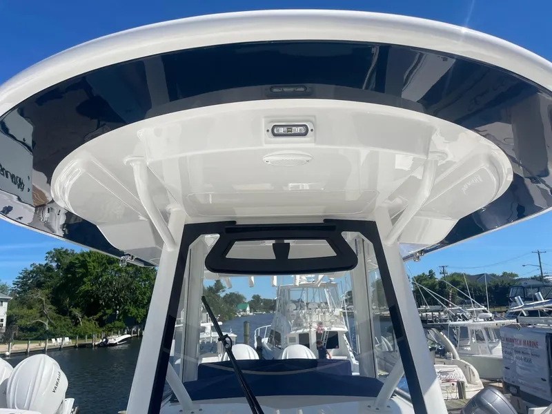 Slide: The Image of Regulator 31 boat 2025, view of helm and hardtop. - 17