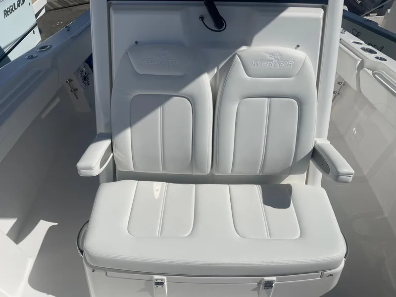 Slide: The Image of 2025 Regulator 31 boat seat with white upholstery. - 18