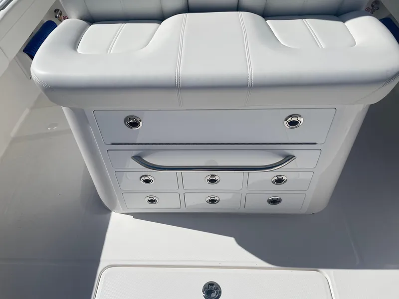 Slide: The Image of Regulator 31 boat, 2025, white seating with storage compartments. - 28