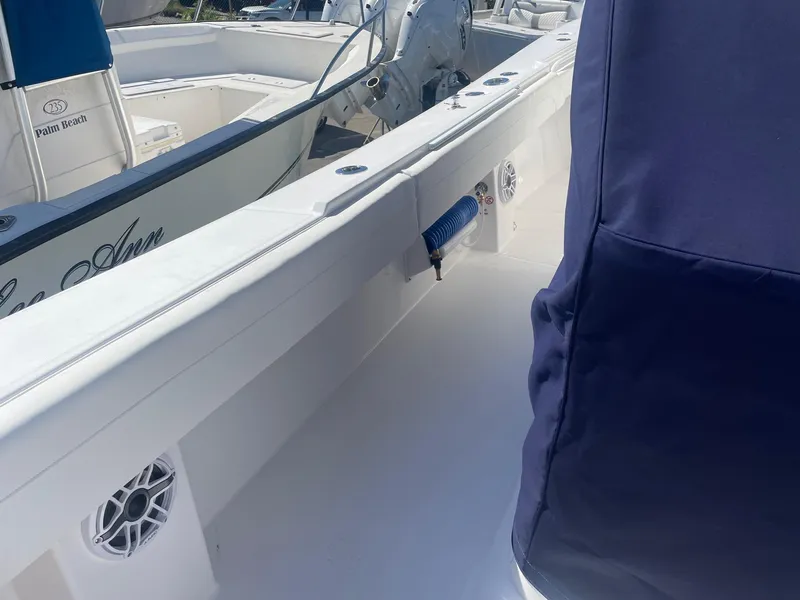 Slide: The Image of Interior view of a 2025 Regulator 31 boat with blue upholstery. - 9