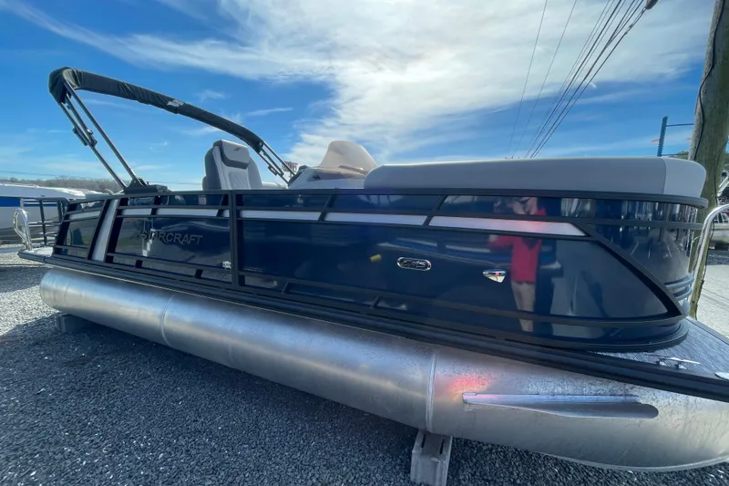 The Image of 2026 Starcraft EXS 1 Q DH pontoon boat with sleek design on display. - 0