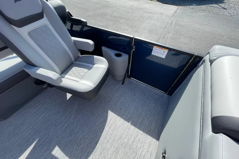 Slide: The Image of Interior of 2026 Starcraft EXS 1 Q DH boat with seating and cup holder. - 10