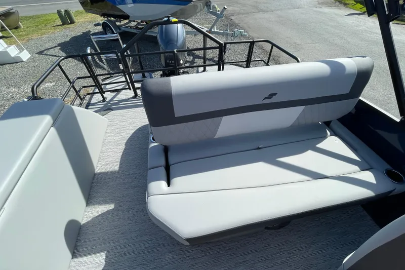 Slide: The Image of 2026 Starcraft EXS 1 Q DH boat interior with gray seating and modern design. - 3