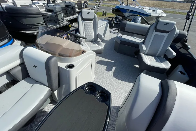 Slide: The Image of 2026 Starcraft EXS 1 Q DH boat interior with modern seating and sleek design. - 7