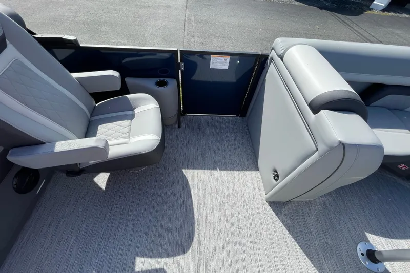 Slide: The Image of Interior of 2026 Starcraft EXS 1 Q DH boat with gray seating and flooring. - 9