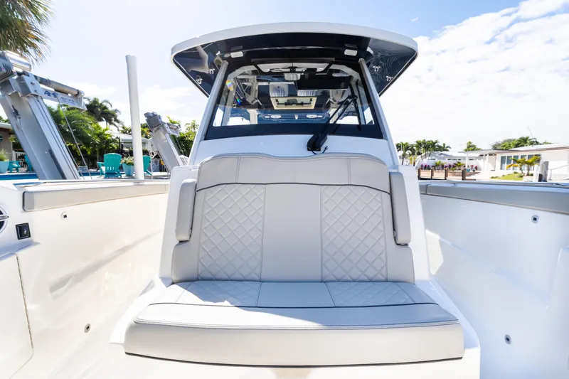 Slide: The Image of 2023 Pursuit S 328 Sport boat interior with cushioned seating and modern design. - 12