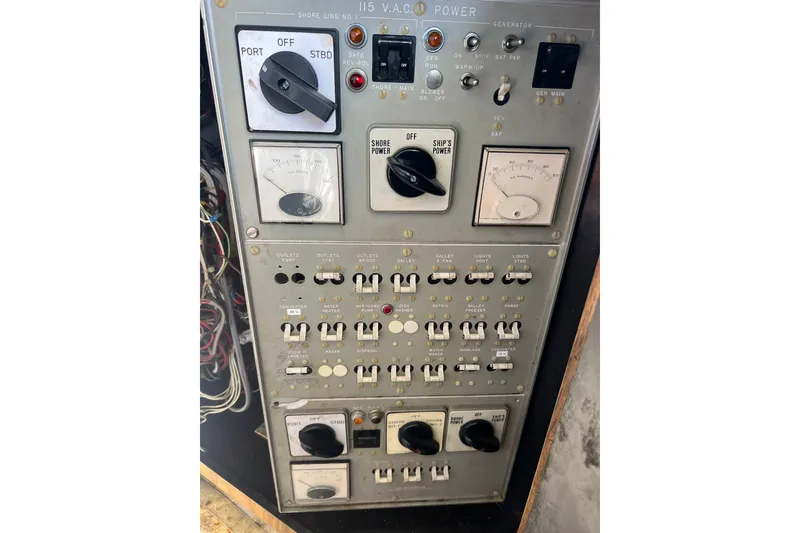 Slide: The Image of Electrical control panel of a 1977 Bertram 46 Convertible boat. - 12