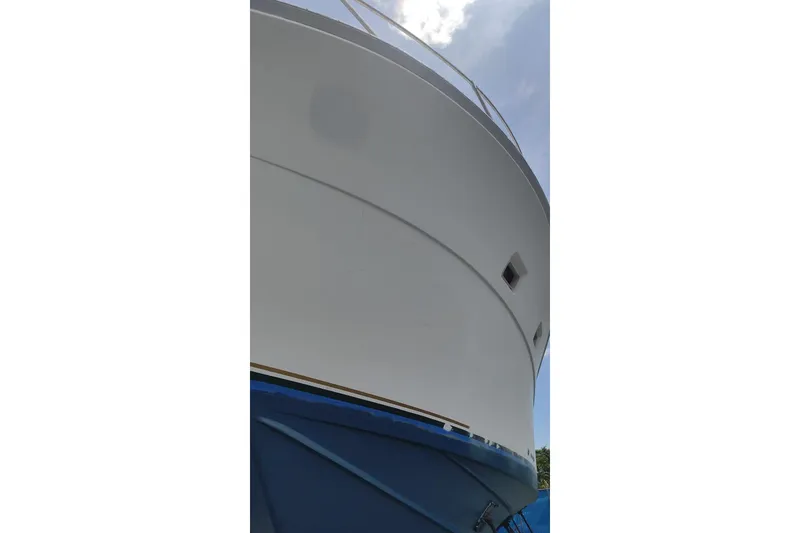 Slide: The Image of 1977 Bertram 46 Convertible yacht, close-up view of hull and bow. - 4
