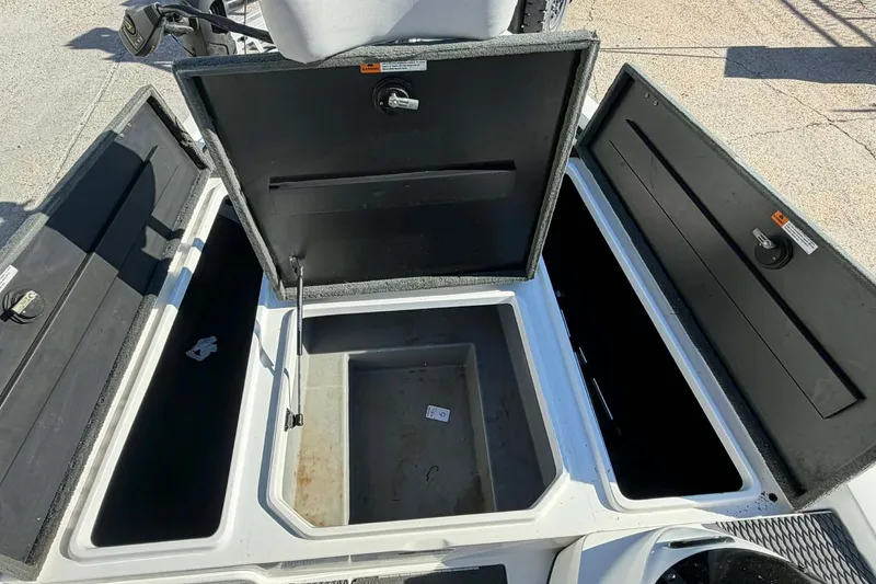 Slide: The Image of Open storage compartments on a 2008 Stratos 285 XL boat. - 10