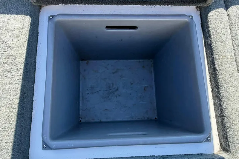 Slide: The Image of Empty storage compartment in a 2008 Stratos 285 XL boat. - 11