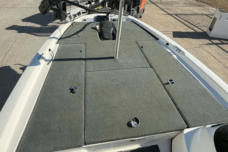 Slide: The Image of 2008 Stratos 285 XL boat deck with carpeted surface and fishing equipment. - 3