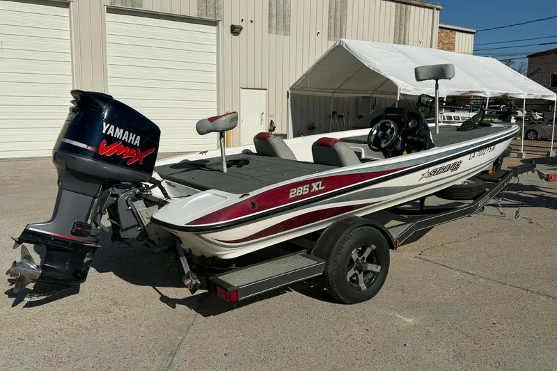 Slide: The Image of 2008 Stratos 285 XL boat with Yamaha VMAX engine, parked on a trailer. - 6