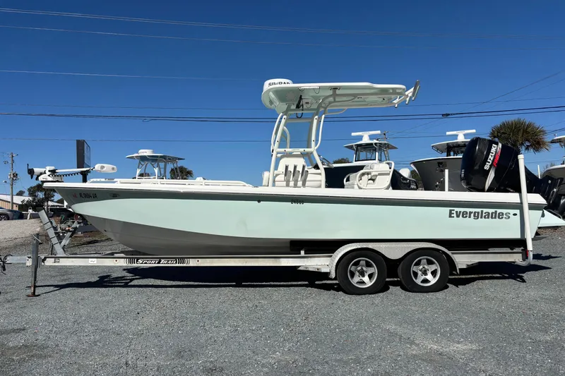 Slide: The Image of 2008 Everglades 243 Center Console boat on trailer, clear sky background. - 0