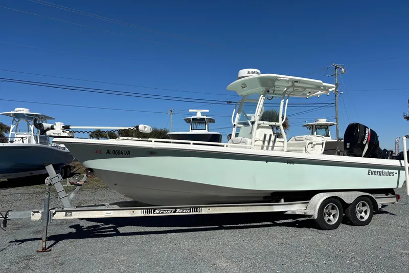 Slide: The Image of 2008 Everglades 243 Center Console boat on trailer under clear blue sky. - 1