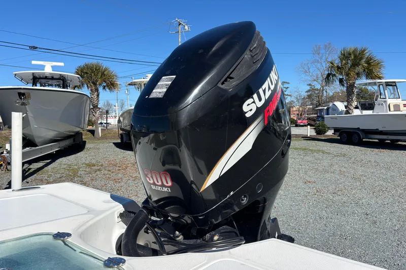 Slide: The Image of 2008 Everglades 243 Center Console with Suzuki 300 outboard motor in a boatyard. - 11